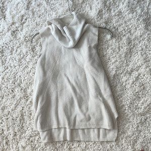 Sleveless turtleneck. Great with white pants
